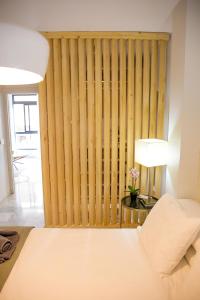 A bed or beds in a room at Beach & Center Premiun