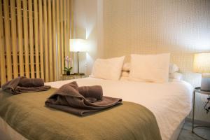 A bed or beds in a room at Beach & Center Premiun
