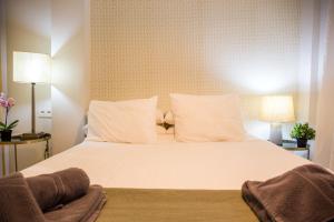 A bed or beds in a room at Beach & Center Premiun