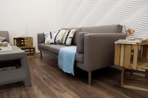 a living room with a couch and a table at Na-Horyzoncie in Ustka +14 photos