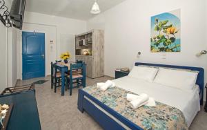 Postel nebo postele na pokoji v ubytování Maistrali Apartments