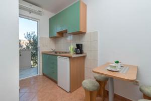 Kuchyň nebo kuchyňský kout v ubytování Apartments Ivana-Gustirna