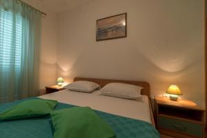 Postel nebo postele na pokoji v ubytování Apartments Ivana-Gustirna