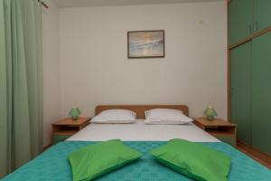 Postel nebo postele na pokoji v ubytování Apartments Ivana-Gustirna