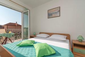 Postel nebo postele na pokoji v ubytování Apartments Ivana-Gustirna