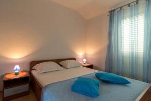 Postel nebo postele na pokoji v ubytování Apartments Ivana-Gustirna