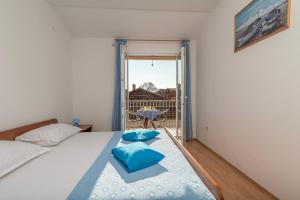Postel nebo postele na pokoji v ubytování Apartments Ivana-Gustirna