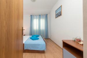 Postel nebo postele na pokoji v ubytování Apartments Ivana-Gustirna