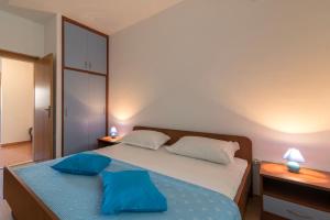 Postel nebo postele na pokoji v ubytování Apartments Ivana-Gustirna