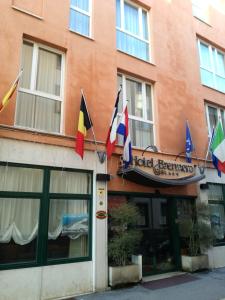 a restaurant with flags on the side of a building at Hotel Brennero in Bassano del Grappa