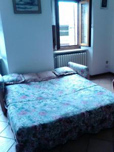 En eller flere senge i et værelse på Appartamenti Serena - Nonna Agnese
