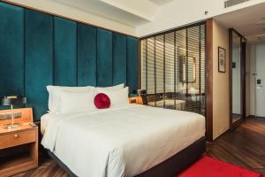Voodi või voodid majutusasutuse WEIL Hotel Ipoh toas