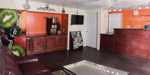 a living room with a couch and a coffee table at Budget Inn in Caldwell