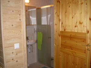a bathroom with a shower and a sink at Pensionat Sågknorren in Bygget +44 photos