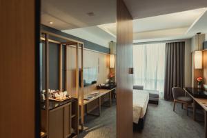 Voodi või voodid majutusasutuse WEIL Hotel Ipoh toas