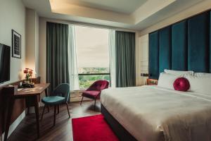Voodi või voodid majutusasutuse WEIL Hotel Ipoh toas
