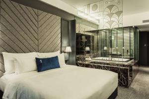 Voodi või voodid majutusasutuse WEIL Hotel Ipoh toas