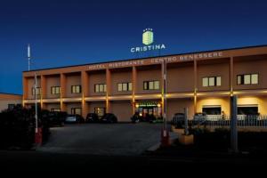a large building with a sign on top of it at Hotel Cristina in Rocca San Giovanni