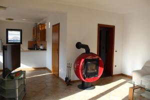 a living room with a fire pit in the corner at Starigrad House in Starigrad