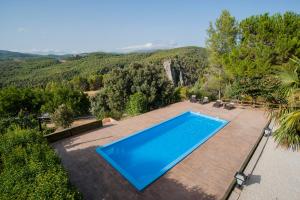 an outdoor swimming pool with a view of the mountains at Casa Bons Aires - adults only in Alcoy