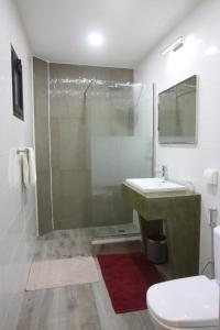 a bathroom with a shower and a sink and a toilet at Hotel VDN by Good Rade in Dakar