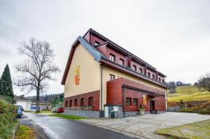 a building on the side of a road at Hotel Toč in Lipova Lazne