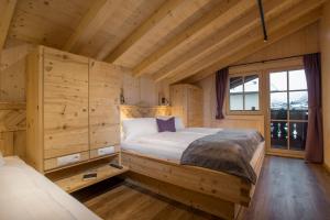 Łóżko lub łóżka w pokoju w obiekcie Alpenchalet Stadlpoint