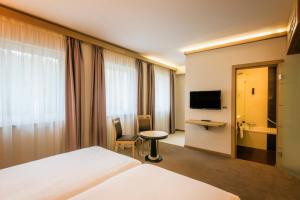 TV a/nebo společenská místnost v ubytování Hotel Bon Repos
