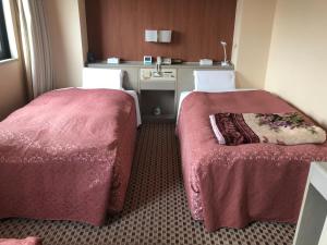 Postel nebo postele na pokoji v ubytování Hotel Hikari Hills