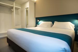 Postel nebo postele na pokoji v ubytování Airone City Hotel