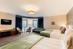 Letto o letti in una camera di Amber Springs Hotel