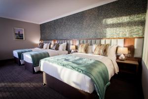 Letto o letti in una camera di Amber Springs Hotel