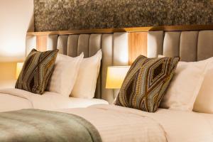 Letto o letti in una camera di Amber Springs Hotel