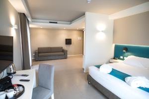 Postel nebo postele na pokoji v ubytování Airone City Hotel