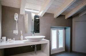 a bathroom with a white sink and a mirror at CHARMING MOMENT di Villa Porta - Residenza Felice in Luino