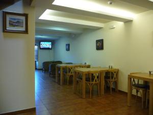 a dining room with wooden tables and chairs at Hortas P.R. in Santiago de Compostela