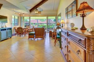 a kitchen and dining room with a table and chairs at Maui Kaanapali Villas E290 in Lahaina