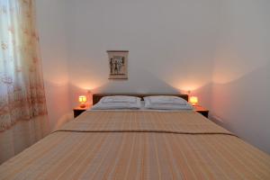 מיטה או מיטות בחדר ב-Nina