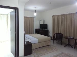 Letto o letti in una camera di Dolphin Hotel