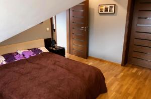 Posteľ alebo postele v izbe v ubytovaní Apartamenty Smile