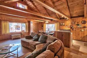a large living room with a couch and a kitchen at Hank Monk Chalet in South Lake Tahoe