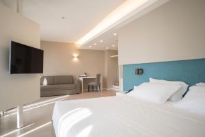 Postel nebo postele na pokoji v ubytování Airone City Hotel