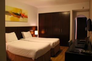 Postel nebo postele na pokoji v ubytování H3 Hotel Paulista