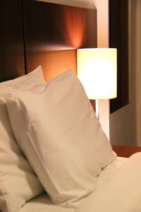 Postel nebo postele na pokoji v ubytování H3 Hotel Paulista