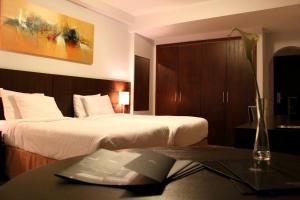 Postel nebo postele na pokoji v ubytování H3 Hotel Paulista