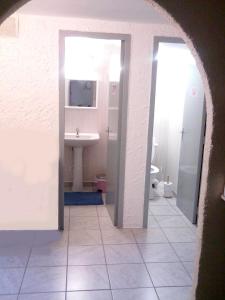 a bathroom with a sink and a toilet at Chambres d'Hôtes Le Clos du Murier in Villefranche-de-Rouergue