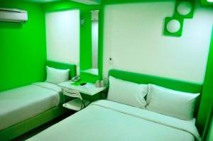 Postel nebo postele na pokoji v ubytování YY318 Hotel Bukit Bintang