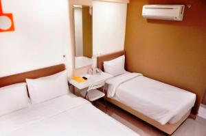 Postel nebo postele na pokoji v ubytování YY318 Hotel Bukit Bintang