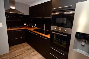 Kuchyň nebo kuchyňský kout v ubytování Le Duplex de la Raveline 48A