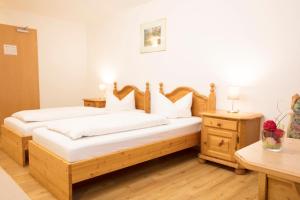 Postel nebo postele na pokoji v ubytování Akzent Hotel Alpenrose